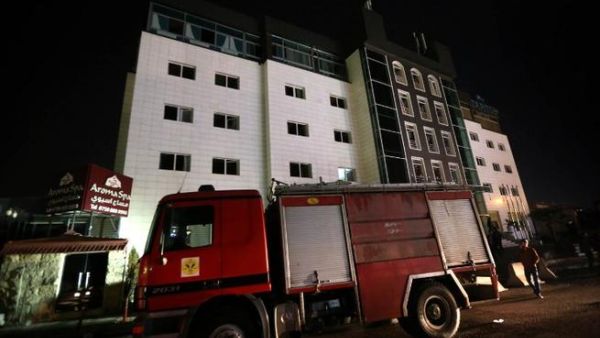 Iraqi firemen work at four-star Capitol Hotel in Arbil, the capital of the autonomous Kurdish region of northern Iraq, on February 5, 2016. (AFP/Safin Hamed)
