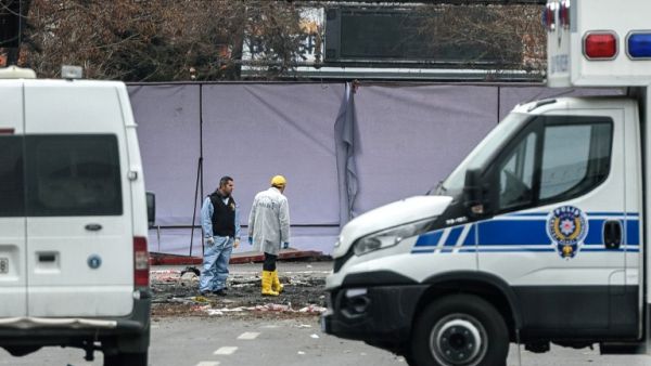 Forensic experts investigate the scene of the explosion on March 14, 2016 in Ankara the day after a suicide car bomb ripped through a busy square in central Ankara killing 37 people and wounding 125, officials said. (AFP/Ozan Kose)
