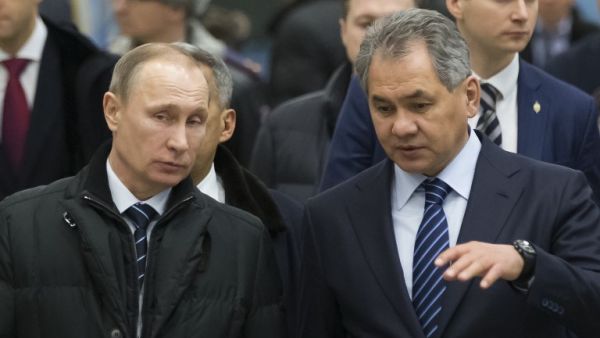 Russian President Vladimir Putin listens to Defence Minister Sergei Shoigu about 450 miles east of Moscow, on February 12, 2016. (AFP/Alexander Zemlianichenko)