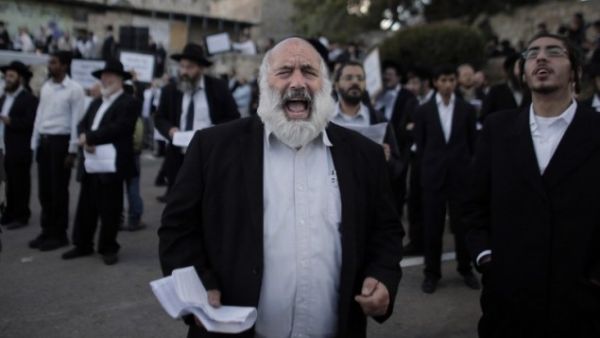 Ultra-Orthodox Jewish men protest against Pope Francis' upcoming visit to the Holy Land, on May 12, 2014 in the Old City of Jerusalem, near King David's tomb. (AFP/Ahmad Gharabli)