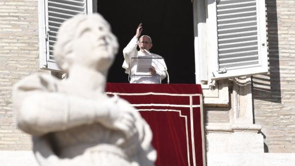 Pope Francis addresses the crowd from the window of the apostolic palace overlooking St Peter's Square on Dec. 17, 2017, in the Vatican (Andreas SOLARO/AFP)