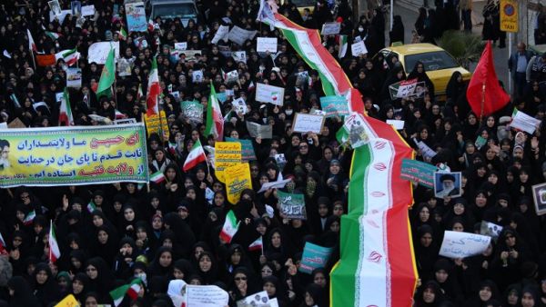 Iranian pro-government supporters march during the funeral of a young member of the Revolutionary Guards, Sajjad Shahsanai, in the city of Najafabad, west of Isfahan, on Jan. 3, 2018 (Morteza SALEHI/TASNIM NEWS/AFP)