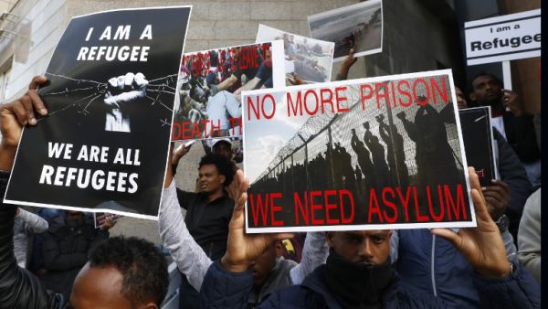African migrants demonstrate against the Israeli government's policy to forcibly deport African refugees and asylum seekers from Israel to Uganda and Rwanda, outside the Rwanda embassy on Jan. 22, 2018 in the Israeli city of Herzliya (JACK GUEZ / AFP)