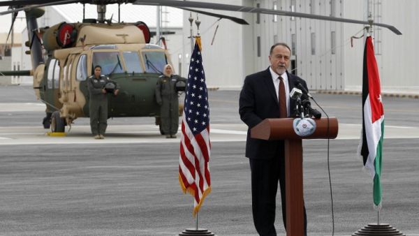 U.S. embassy charge d'affaires Henry Wooster delivers a speach in front of a Black Hawk helicopter during a handing over ceremony at the King Abdullah II Air Base in Zarqa on Jan. 28, 2018 (STRINGER / AFP)