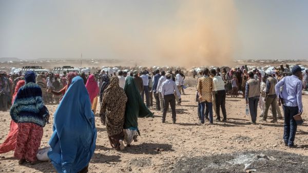 People gather prior to a food distribution at the Internally displaced person camp (IDP) of Farburo in Gode, near Kebri Dahar, southeastern Ethiopia, on Jan. 27, 2018. The camp recently hosted Somali families fleeing conflict between Somali and Oromo communities in Ethiopia (YONAS TADESSE / AFP)