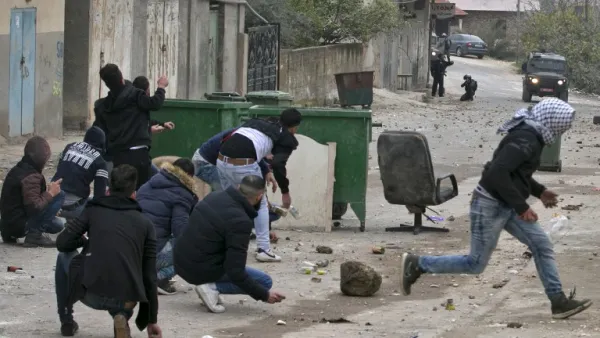 Palestinian youths clash with Israeli forces in the village of al-Yamun, on the outskirts of Jenin, in the occupied West Bank on Feb. 6, 2018 following an operation by the Israeli army (JAAFAR ASHTIYEH / AFP)