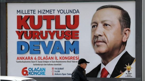 A billboard displays an image of President of Turkey and Leader of the Justice and Development Party (AK Party) Recep Tayyip Erdogan reading "continue the blessed march " in Ankara, on Feb. 14, 2018, four days ahead of the party's 6th ordinary congress in the Turkish capital. 
(ADEM ALTAN / AFP)