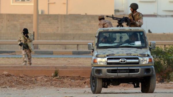 Libyans loyal to the LNA patrolling Benghazi in 2014. (AFP/File) Libyans loyal to the LNA patrolling Benghazi in 2014. (AFP/File)