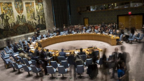 (FILES): In this long exposure photograph, the United Nations Security Council meets concerning the situation in the Middle East, at UN headquarters, April 26, 2018 in New York City. Israel claimed that Iran is using Syria to build a new military front against Israel. Among other topics discussed in the Security Council meeting included discussion about the mass protests along the border fence between the Gaza Strip and Israel. 
(Drew Angerer / GETTY IMAGES NORTH AMERICA / AFP)