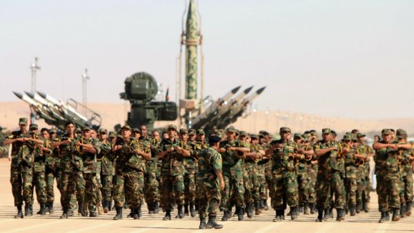 Soldiers from the self-styled army of Libyan Strongman Khalifa Haftar take part in a military parade in the eastern city of Benghazi. (Abdullah Doma / AFP)