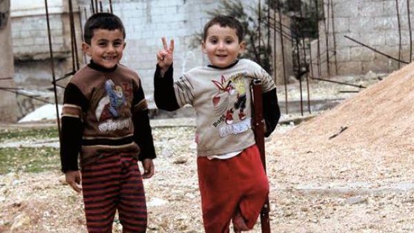 Syrian boys pose for a photo. (Facebook) 