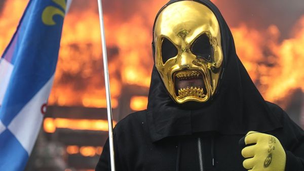 The protesters were attempting to march on the Elysee Palace, Mr Macron's official home, but were held back by barriers and rows of police (AFP)