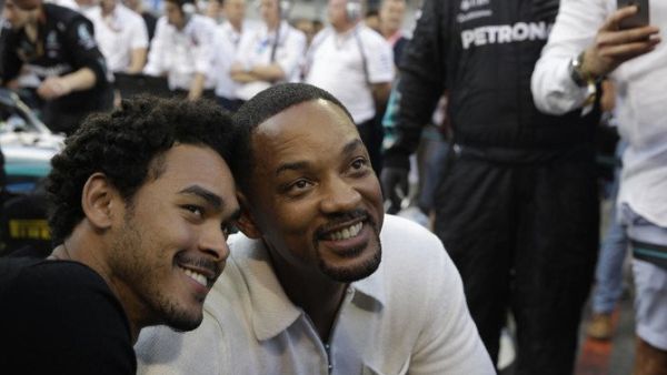 Will Smith and his son Trey visit the pit lane during the Abu Dhabi Formula One Grand Prix. (Source: AFP)