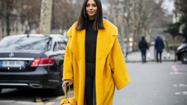 Nathalie stepped out this week wearing an oversized yellow coat over an all-black outfit (Source: nathaliefanj - Instagram)