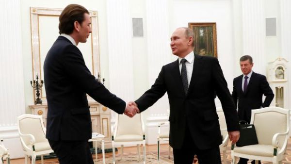 Austria's Chancellor Sebastian Kurz in previous meeting shakes hands with Russia's President Vladimir Putin (AFP/File Photo)	