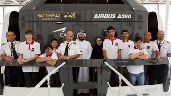 A student learns from an Etihad Airways captain about adjusting to altitude and weather conditions in the air. A student learns from an Etihad Airways captain about adjusting to altitude and weather conditions in the air.