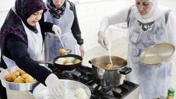 Telling the stories of Syrians displaced by conflict through food is a way to eliminate the “victimizing angle, because the war is not the whole thing, and taste and flavors have their place in their narrative” (AFP/File)