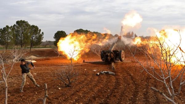 An opposition fighter fires a missile from a village near al Tamanah during ongoing battles with regime forces in Syria's Idlib province. (AFP/File)
