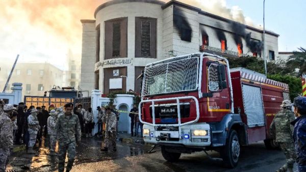 A firetruck and security officers at the scene of an attack on the Libyan foreign ministry in Tripoli on December 25, 2018 (AFP/Mahmud TURKIA)