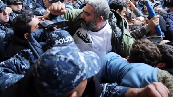 Internal Security Forces officer slapping an Electricité du Liban worker went viral over the weekend, sparking outrage and prompting the ISF to promise to open an investigation/AFP
