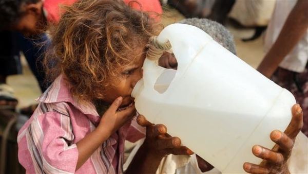 A Yemeni girl drinks water collected from a well in an impoverished village on the outskirts of the port city of Hudaydah. (AFP)
