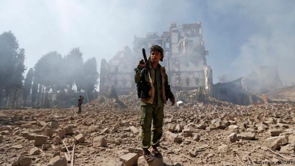 Yemeni soldier stands amongst the rubble as a result of the destructive conflict (AFP/File Photo)	