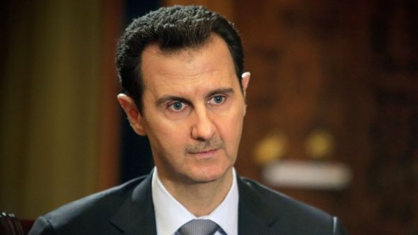"In 10 years, if I can save Syria as president –- but that doesn't mean I'm still going to be president in 10 years, I'm just talking about my vision of the 10 years," he said in an interview published on the newspaper's website. (AFP/Joseph Eid)