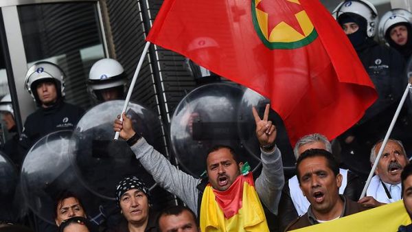 Protesters wave a Kurdistan Workers' Party (PKK) flag at the European Parliament in Brussels, Oct 7, 2014. (AFP/File)