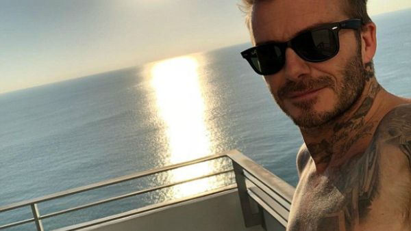 'Look stressed there Becks!' Cocky David shared a sun-soaked snap from aboard a boat in Miami... prompting fellow-footballer Steven Gerrard to tease him for fleeing London's snow (Source: David Beckham -
 Instagram)