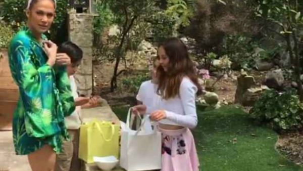 In the beginning: the 43-year-old star started the day clothed in a frond-patterned green and blue kimono (Source: Jennifer Lopez - Instagram)