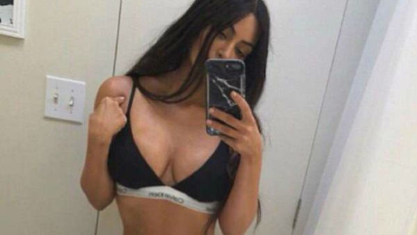 Lining it up: Kim Kardashian has been accused of using Photoshop again, after posting a sizzling lingerie-clad image on Instagram on Wednesday evening (Source: Kim Kardashian - Instagram)