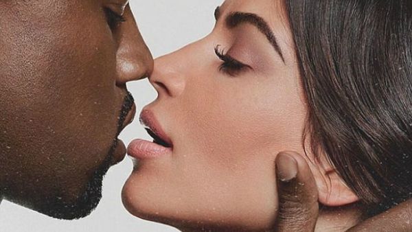 Smooch: Kim Kardashian is proving the love is still alive with husband Kanye West. On Saturday the reality TV star, 37, shared an intimate photo to Instagram where she was kissing the rapper (Source: Kim Kardashian - Instagram)