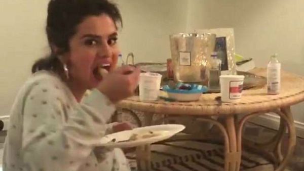 Letting loose: Selena Gomez was spotted in a cute video of herself and a friend about to gorge on pizza and ice cream with no regrets on Friday (Source: Selena Gomez - Instagram)
