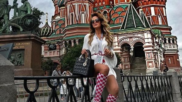 Adriana Đurđević, glamorous girlfriend of centre-back Duje Caleta-Car, poses in front of St Basil's Cathedral, wearing Croatian team socks, ahead of tonight's match (Instagram) 