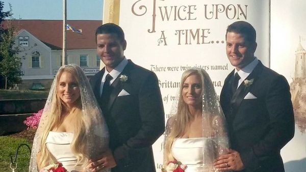 The couples tied the knot side-by-side in a ceremony that was themed 'Twice Upon a Time' (Facebook)