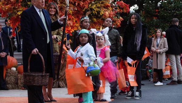 Kids lined up down the South Lawn to see the president and first lady (AFP)