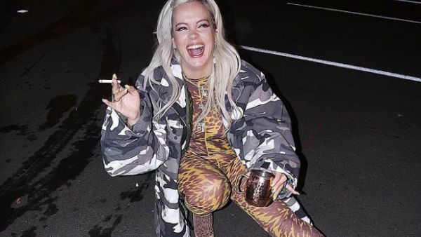 Smoking hot stuff: Lily Allen exhibited her fantastic figure in a tight bodysuit after performing in Colorado on Tuesday... as she claimed she put on FOUR stone during No Shame tour (Source: Lilly Allen - Instagram)