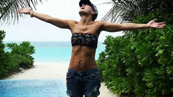 Breaktime: Emma Willis, 42, took a well deserved 'family moon' to the Maldives as she showed of her enviably trimmed body in a tiny bikini top and shorts (Source: emmawillisofficial - Instagram)