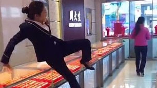 As bewildered shop assistants leap over the counter and give chase, the practical jokers stop short of the door to admire themselves in front of a mirror, leaving the employees red-faced (Facebook)