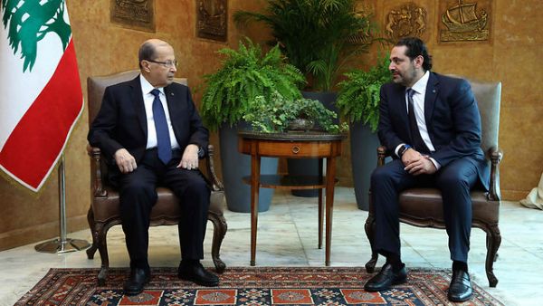 Lebanon President Michel Aoun (L) with Saad al-Hariri. (AFP/ File Photo)