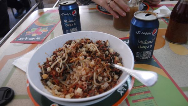 Koshari, the national dish of Egypt,  is a tasty blend of rice, lentils, pasta and chickpeas all in one meal. (Image: Flickr user Kris Fricke)