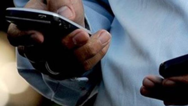 A man checking his phone (AFP/File Photo)	