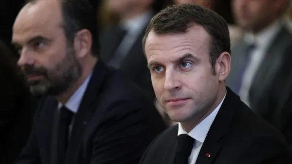 French President Emmanuel Macron (R) and French Prime Minister Edouard Philippe (L)  (AFP)