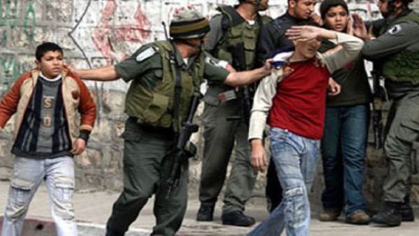 Israeli soldier has been caught on camera shooting tear gas into a Palestinian school  (Twitter)