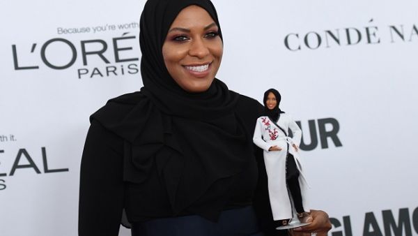 US Olympic medalist Ibtihaj Muhammad with her Barbie model. (AFP)