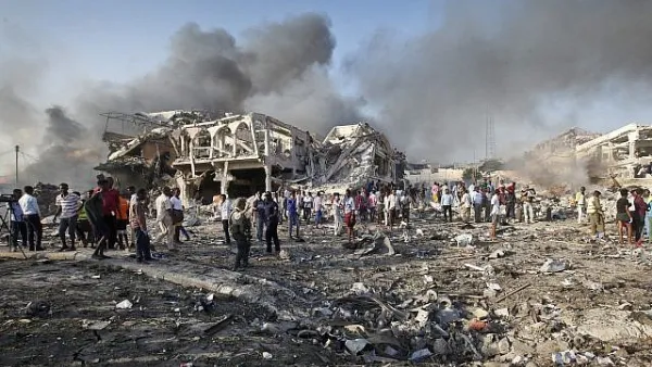 Somalis gather and search for survivors at the scene of a blast in the capital Mogadishu. (AFP)