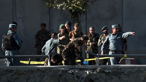 Afghan police examine the site of two suicide bombings in Kabul on September 5, 2016. (AFP/Wakil Kashar)