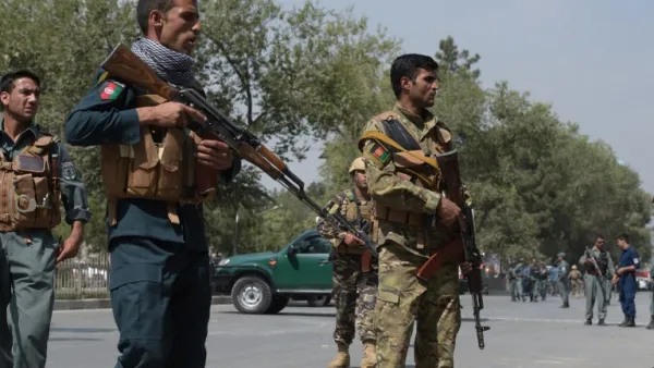 Afghan security personnel keep watch at the site of a suicide attack outside a bank near the US embassy in Kabul on August 29, 2017 (AFP)
