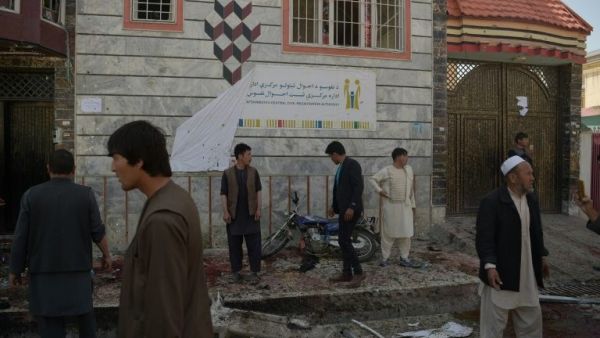 Residents inspect site of a suicide bombing outside the voter registration center. (AFP/ File Photo)