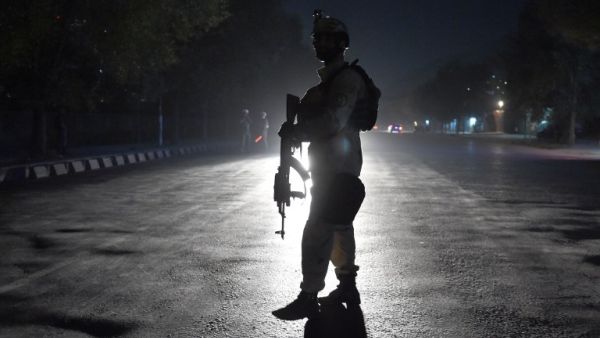 An Afghan security personnel walks as he keep watch near the site of an attack by gunmen inside the Kart-e- Sakhi shrine in Kabul on October 11, 2016. (AFP/Wakil Kohsar)